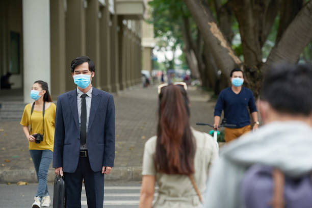istock Asian businessman in protective mask 641962640