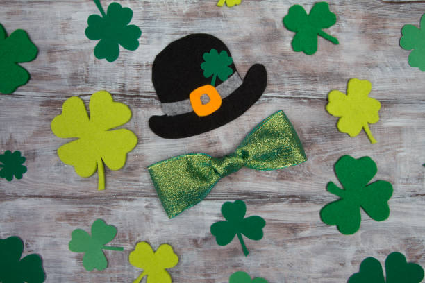 istock Black hat St. Patrick clover leaves and shiny bow 641963074