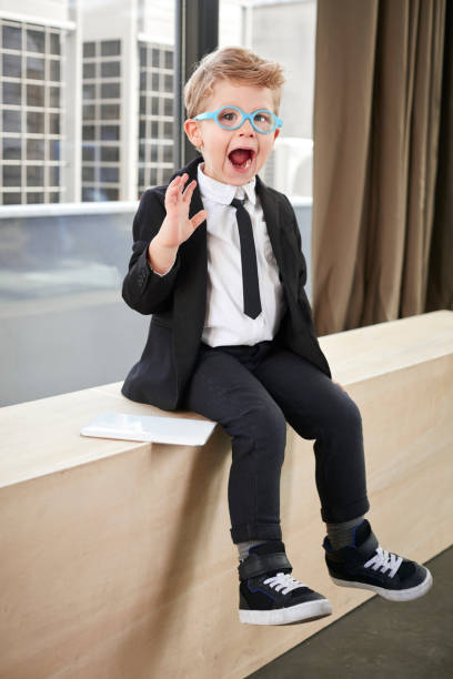 istock Little boy in spectacles and suit 641963232