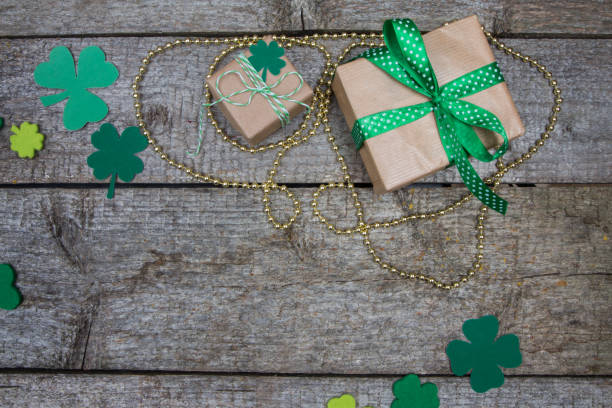 istock Two gift in kraft paper and clover leaves. Patricks Day 641963386