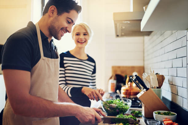 this recipe requires a whole lot of loving - vegetable men cutting adult imagens e fotografias de stock