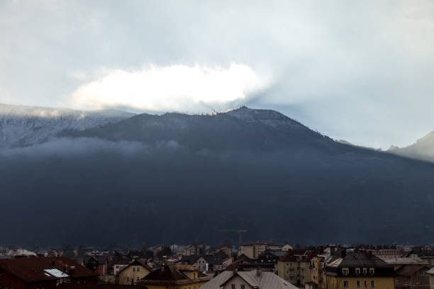 istock Sun is rising behind mountain above the small town 641967378