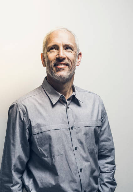 istock Businessman looking up over white background 641967546