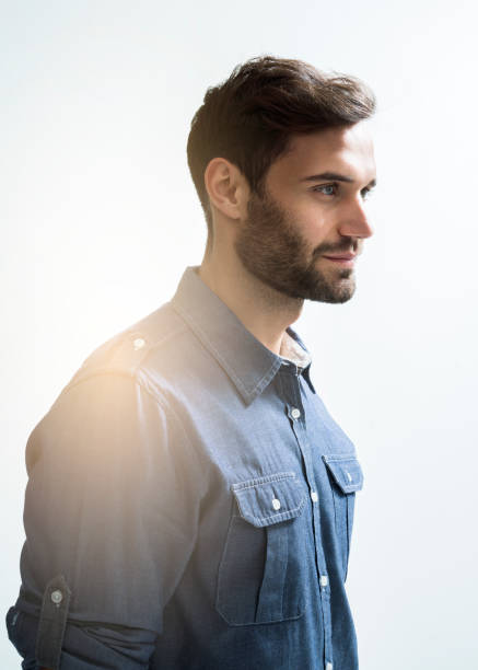 istock Side view of businessman looking away over white 641967558