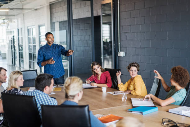 istock Businessman pointing at executive during meeting 641970902