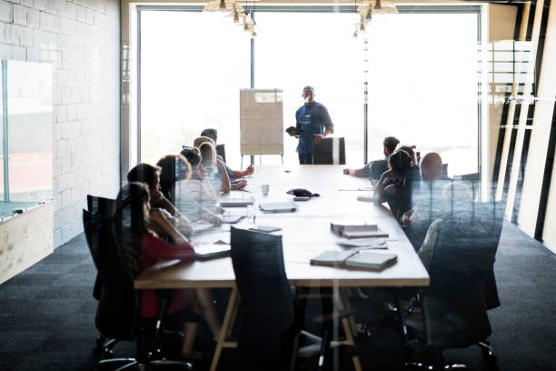 Businessman giving presentation in board room