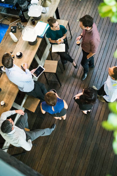 istock Business people having coffee in office cafe 641971372