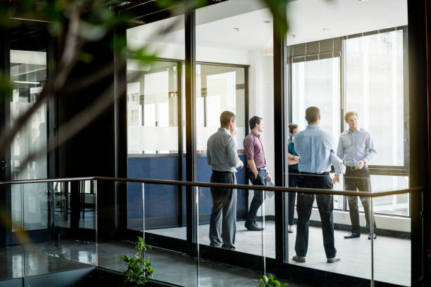 istock Confident business people in meeting at office 641972554