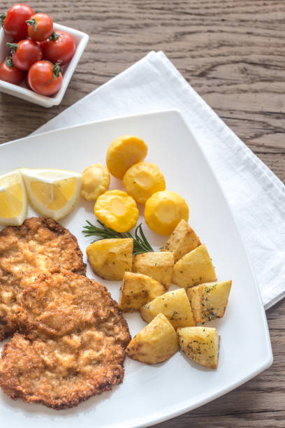 istock Portion of schnitzel with garnish 641973368