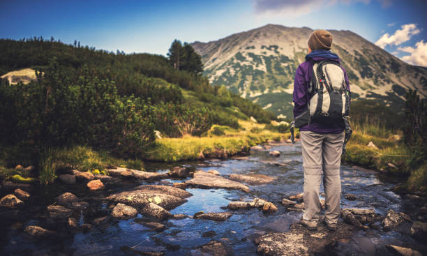 istock Walking alone in the mountains at sunset 641975338