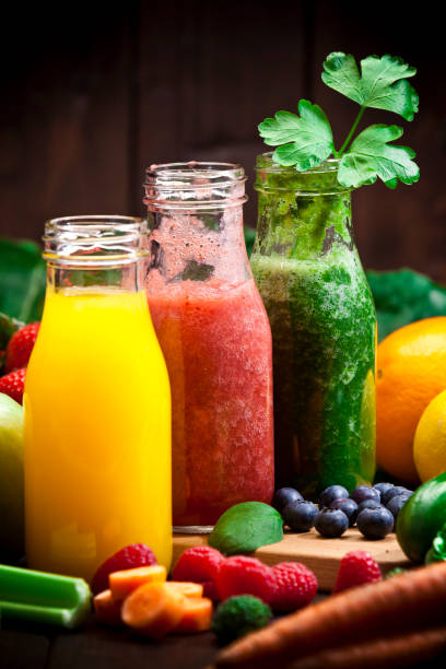 Three fruits and vegetables detox drinks Healthy eating concept: Vertical fruit juice stock pictures, royalty-free photos & images