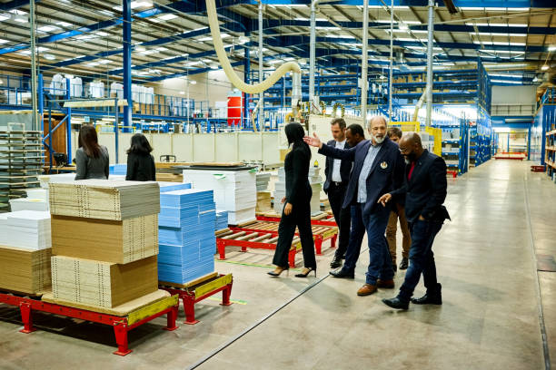 istock Business team on a visit in plant 641975598