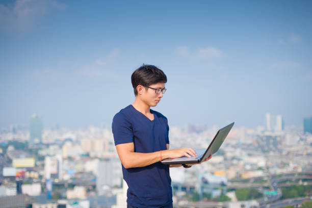 istock Asian business man using laptop and digital tablet 641976298