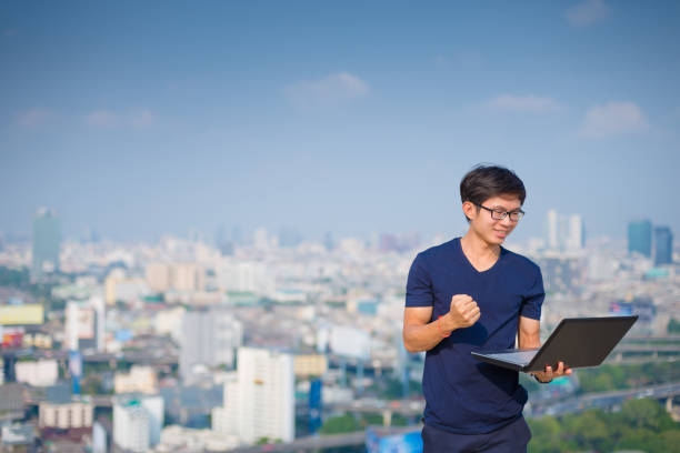 istock Asian business man using laptop and digital tablet 641976512