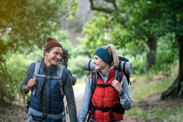 istock Happy young couple hiking in forest 641976704