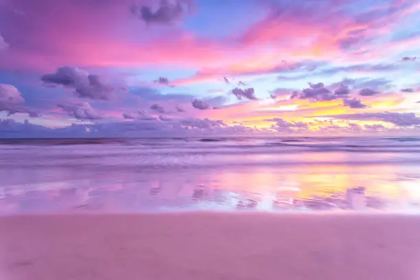 Photo of Sunrise reflections over the beach