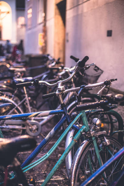 istock Close up on a wet bikes parked in a street 641984482