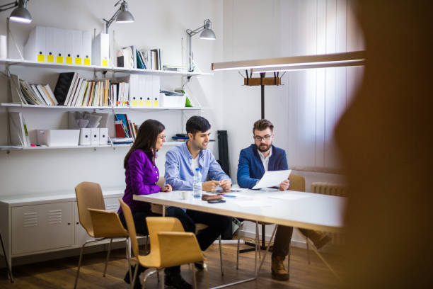 istock Designers sharing ideas on a meeting 641989730