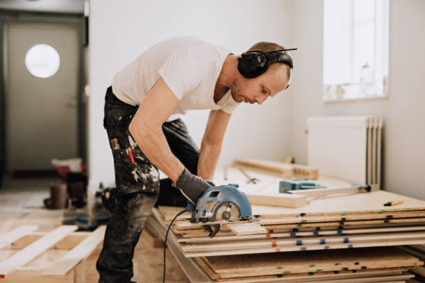 Man working and renovating a house stock photo