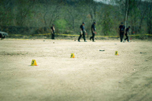 evidence marker with blurred forensic background in cenematic tone evidence marker with blurred forensic and law enforcement team searching in crime scene training with copy space and cinematic tone bomb photos stock pictures, royalty-free photos & images