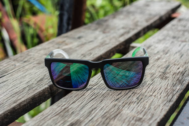 istock Sunglasses on a wooden table 641997642