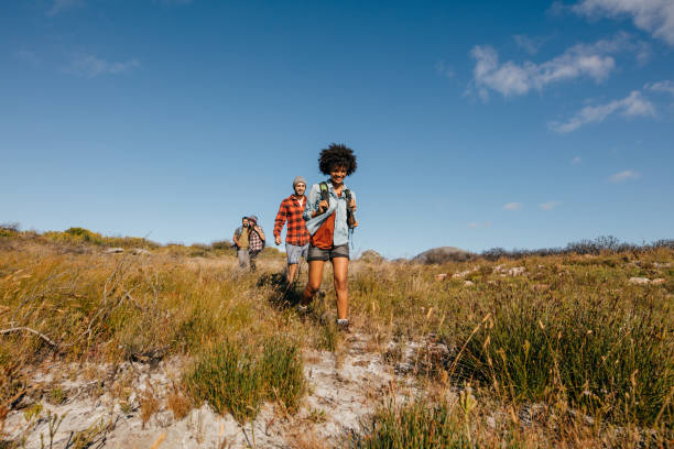 istock Group of friends walking through countryside 642002104