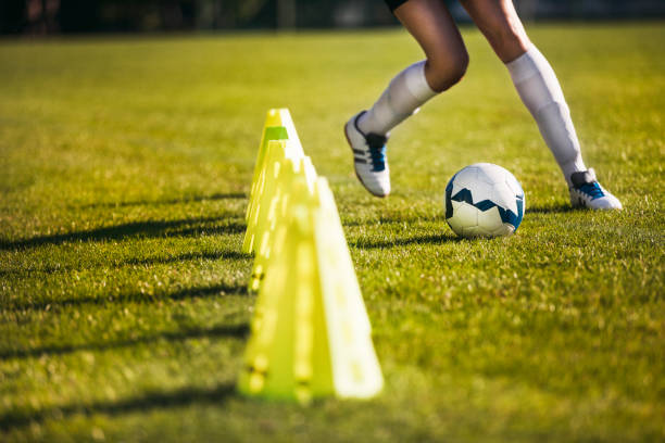 istock Female soccer player - slalom drills training 642002564