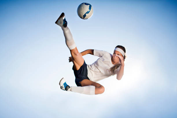 istock Female soccer player - bicycle kick 642002800