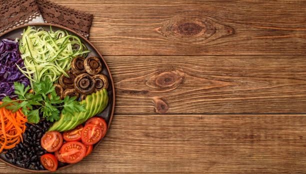 istock Buddha bowl of mixed vegetable on the wooden table. 642005946