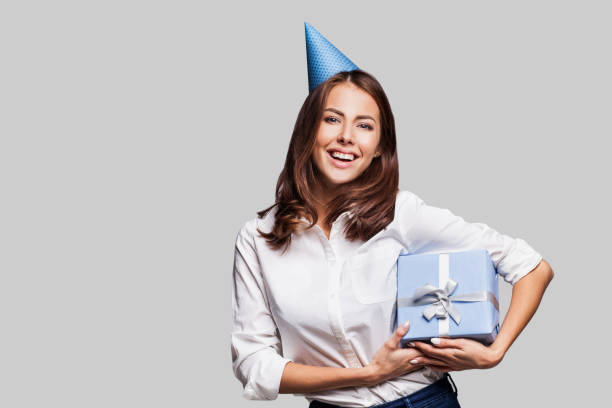 istock Happy woman with a gift 642006354