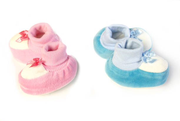 istock Pink and blue newborn shoes 642010972