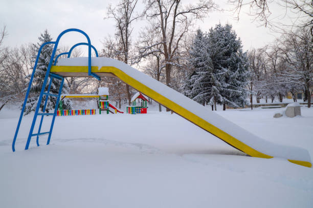 istock Children's playground covered with snow 642012654