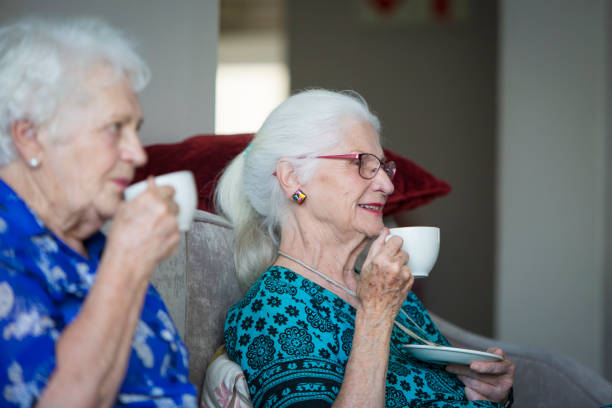 istock Drinking tea - senior women at home 642012888