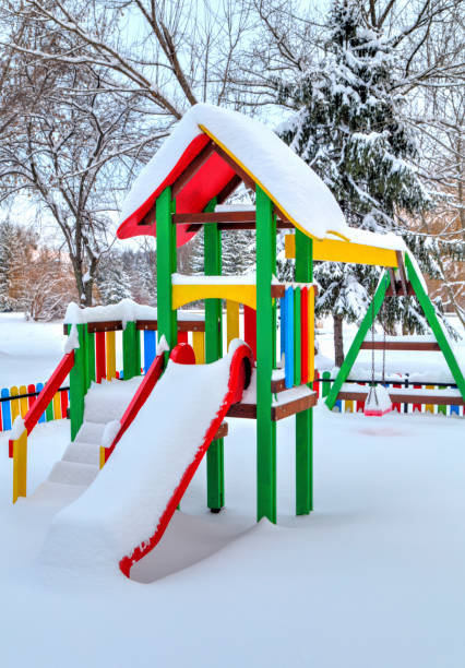 istock Children's playground covered with snow 642013352