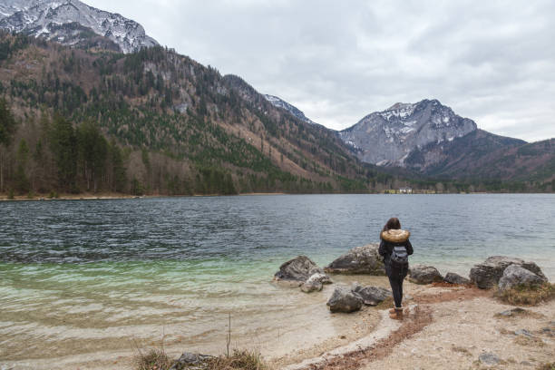 istock Female backpacker standing on a Langbathsee lake shore 642014260