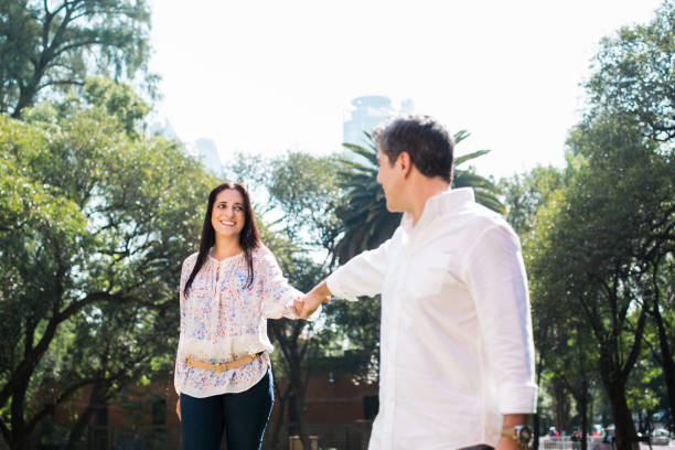 istock Mature couple holding hands and smiling 642020260