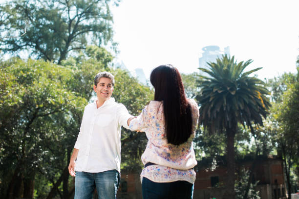 istock Mature couple standing face to face and holding hands 642020284