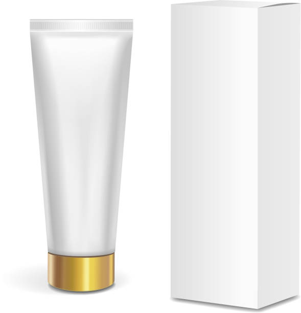 istock Cosmetic tube container with gold lid and white box isolated on white background. Mock up packaging 642022202