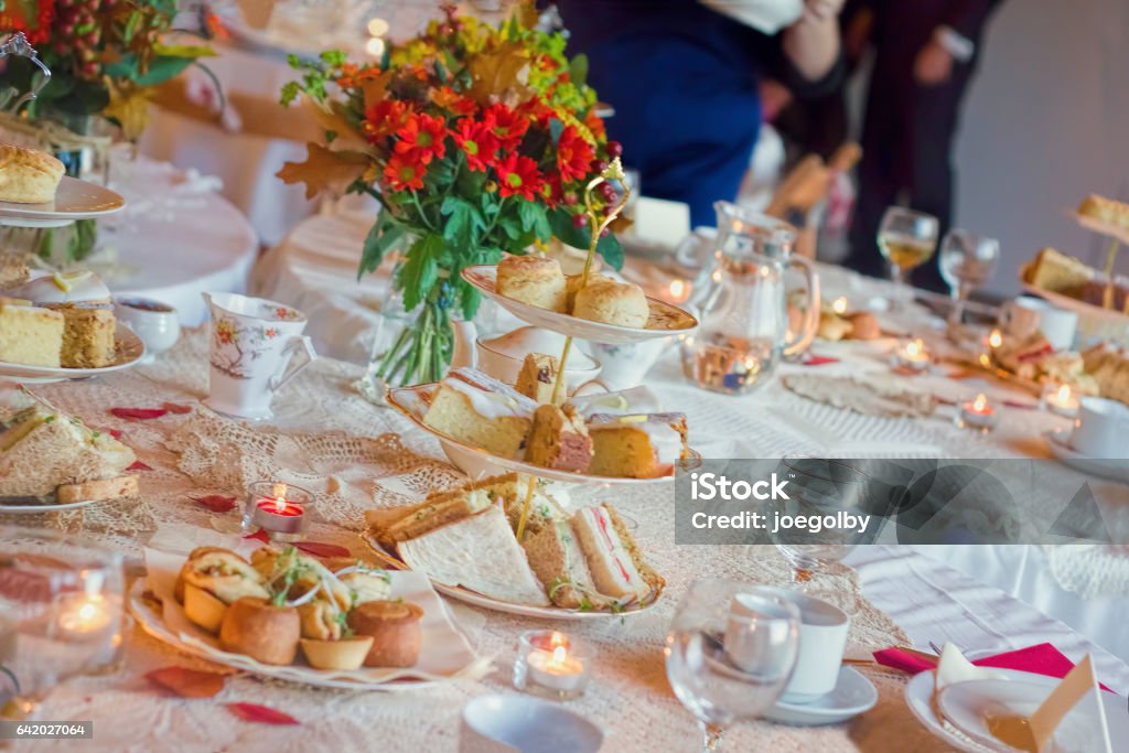 Afternoon Tea Service. Traditional English Luxury Afternoon tea service with, sandwiches, savory pastries and cakes. Afternoon Tea Stock Photo