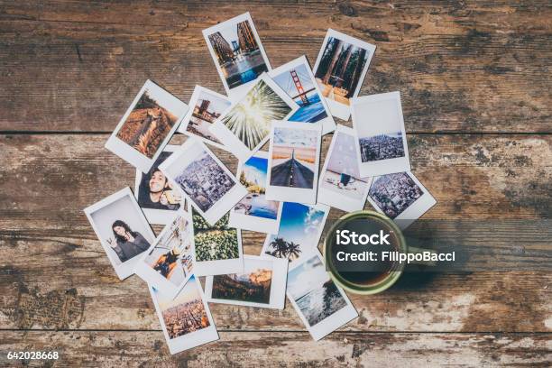 Instant Camera Prints On A Table Stock Photo - Download Image Now - Instant Camera, Instant Print Transfer, Table