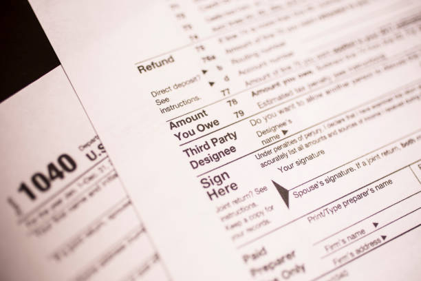 istock Income Tax forms close-up view. 642029466