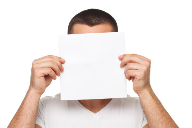istock Young men  with blank paper   on his face 642029808