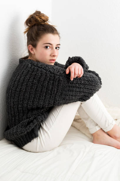 istock Young woman with serious face on a white background. 642031684