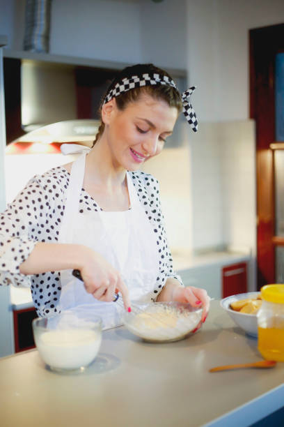 istock Young woman enjoyng in the kitchen 642033052