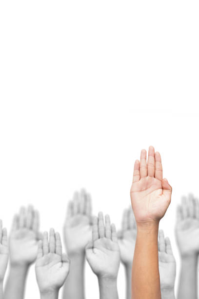Business crowd raising hands high up on white background. stock photo