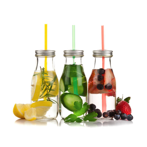 istock Three infused lemon water detox drinks on white background 642034392