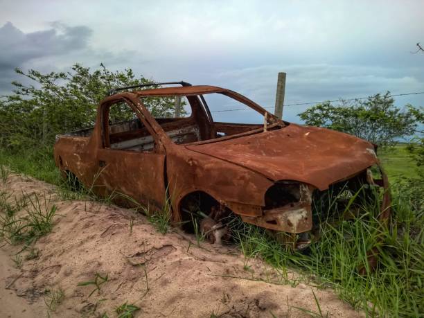 istock Abandoned broken car on the road 642034562