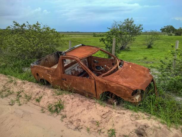 istock Abandoned broken car on the road 642034600
