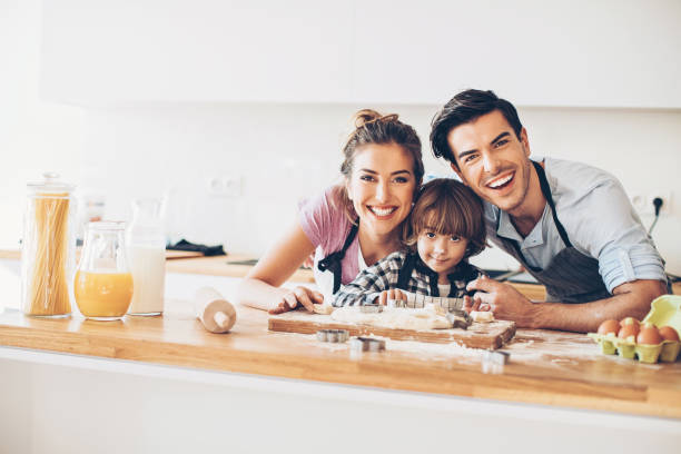 istock Young family with small boy in a messy kitchen 642034922