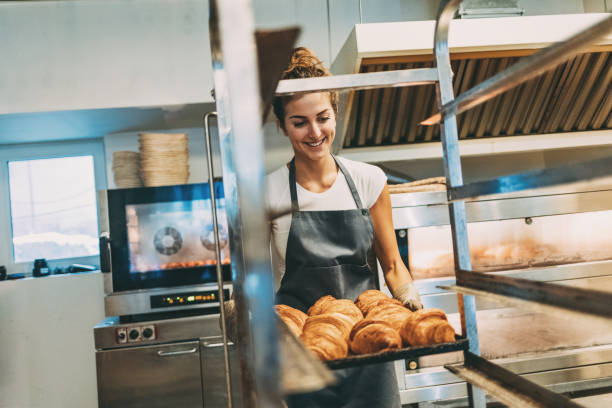 istock Baker with freshly baked croissants 642034932